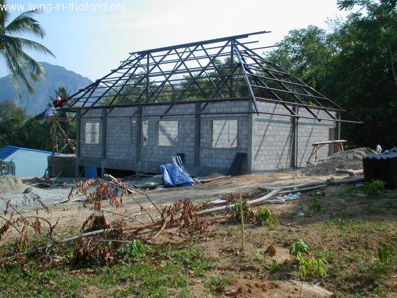 Walls done, roof almost. New roofs are now made from steel, less problems with termites. 